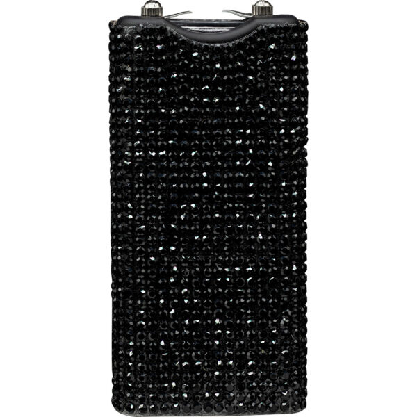 The image features a black 9V battery covered in small, shiny black rhinestones, giving it a sparkling, glamorous appearance. The rhinestones are evenly distributed across the entire surface, providing a luxurious and decorative texture. The top part of the battery shows the dual terminal connectors typically found on a 9V battery. This unique design combines functionality with