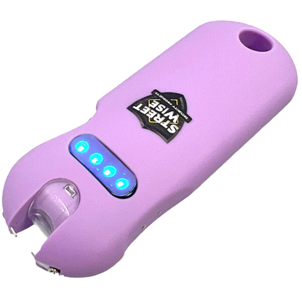 The image shows a compact personal safety device in light purple, designed as a stun gun for self-defense. This StreetWise brand gadget features a sleek, rounded design. Prominently displayed near the top center is the brand's logo, Street Wise Security Products, in bold, capital letters. Below the logo, the device has a series of blue