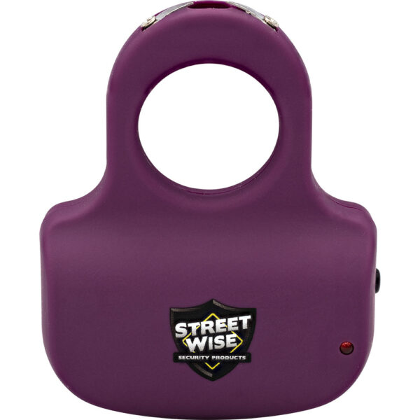 This image features a purple handheld self-defense device prominently displaying the logo of Street Wise Security Products. The design includes a large circular opening at the top, likely for grip purposes, and the device's body appears ergonomically shaped for easy handling. A small red indicator light is visible on the lower right side, often indicative of an operational or charging status