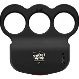 The image shows a black self-defense device resembling brass knuckles. It is designed by Streetwise Security Products. The device features three circular finger holes at the top, and the brand logo is prominently displayed in the center on the front surface. A small micro USB port can be seen on the right side, indicating it is rechargeable. The overall shape is